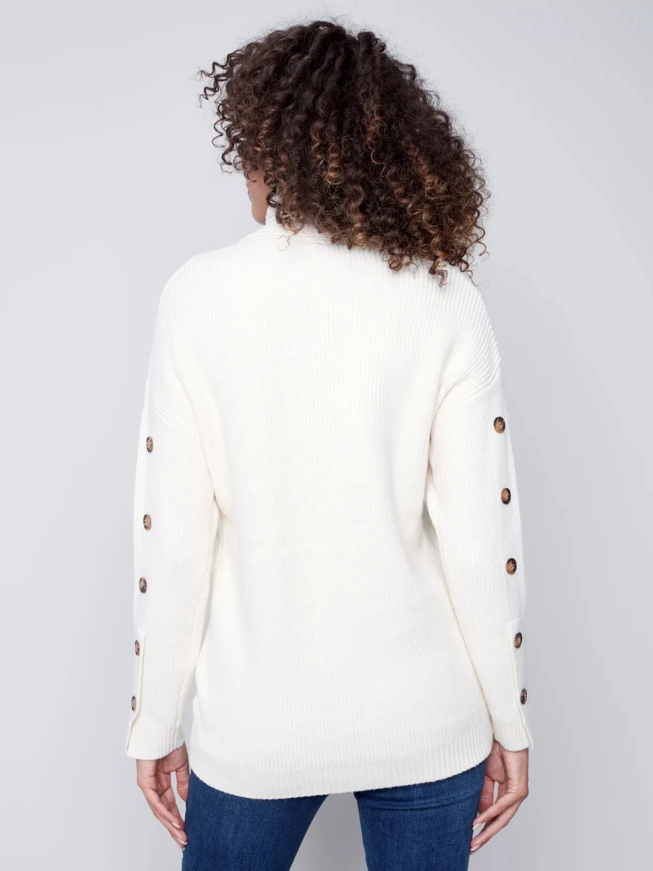 TURTLENECK WITH BUTTON SLEEVE DETAIL